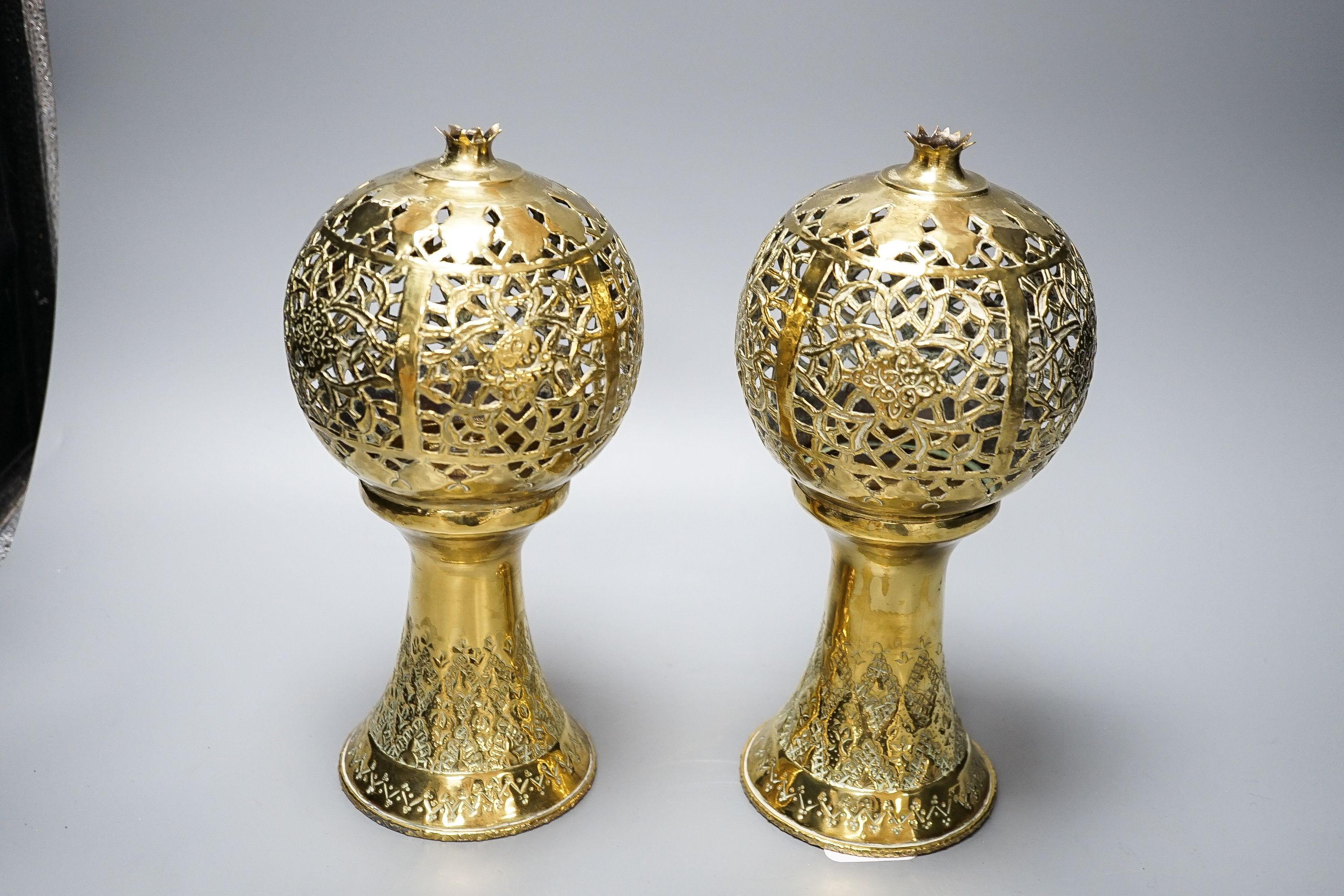 A pair of Indian brass incense burners, each of pomegranate form, 28cm